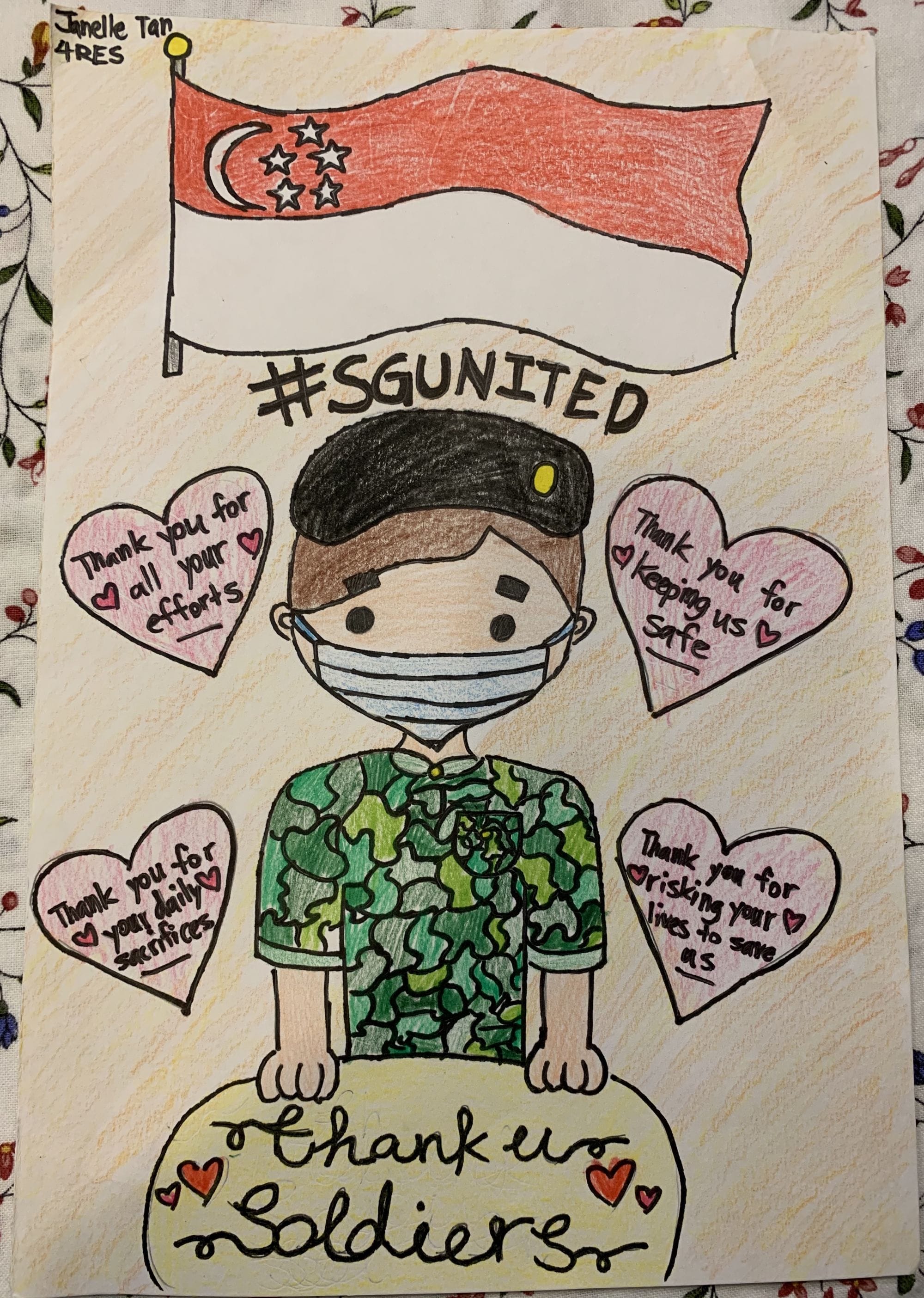 Child's colored drawing of a masked soldier under the Singapore flag with thank-you hearts and text reading SGUnited and Thank You Soldiers.